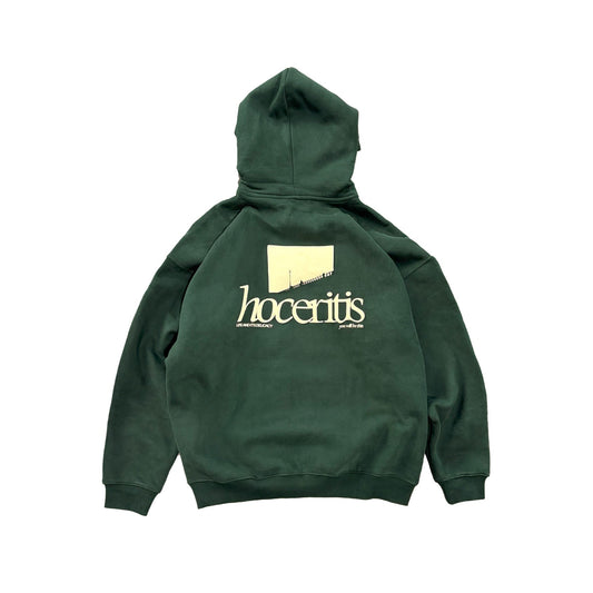 Green hoodie with 'hoceritis' logo on the back against a white background