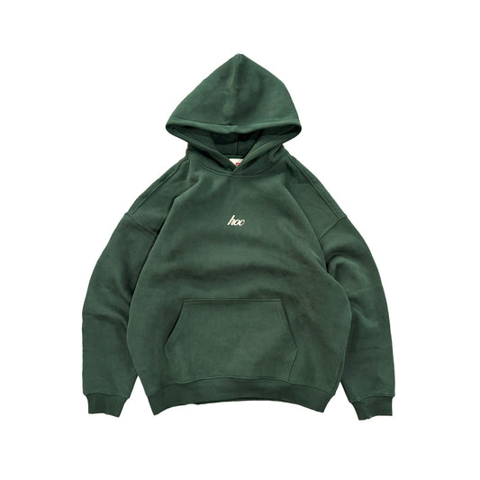 Green hoodie with a small white hoc logo on a white background